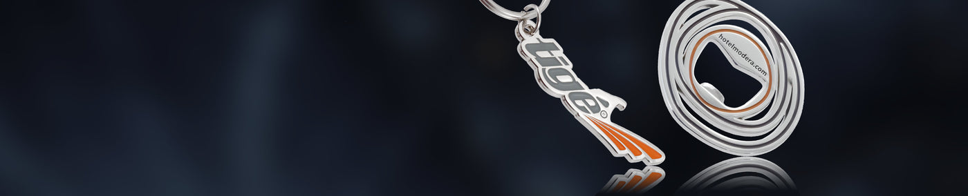 Two nickel plated die cast bottle openers with custom logo branding