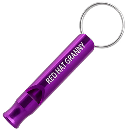 Example of a purple Aluminum Bobby Safety Whistle showing custom engraving. Engraving is a silvery white color.