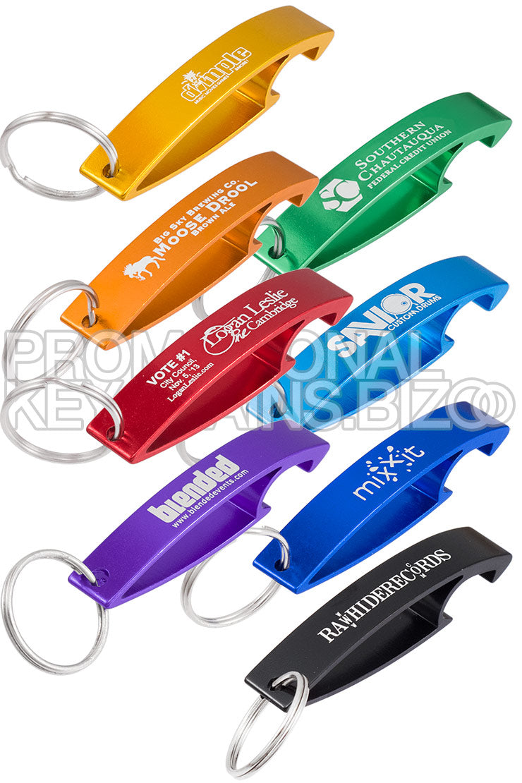 Image shows multiple Aluma Keychain Bottle Openers in different colors and with custom engravings. Colors shown are gold, orange, green, red, aqua, purple, royal blue, black