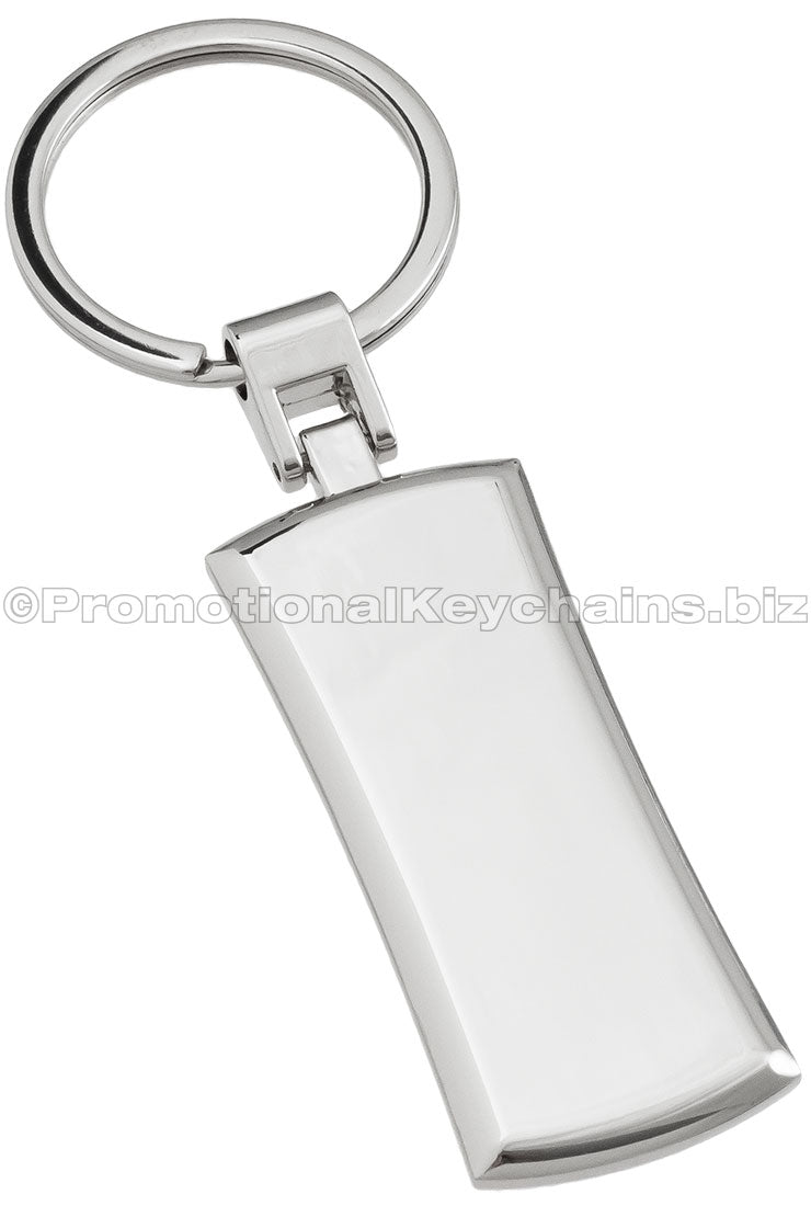 The blank back of a polished, rectangular metal keychain.