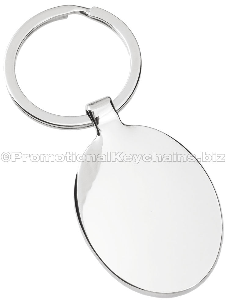 The back of a polished metal keychain in an ovular shape.