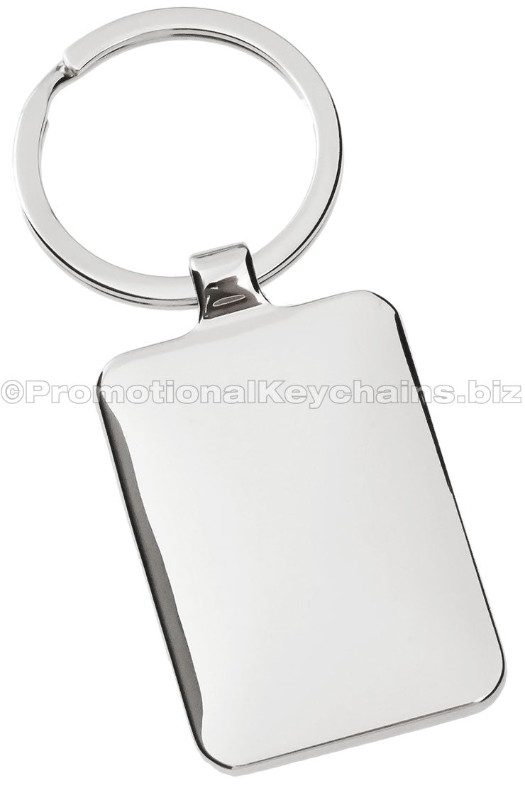 The blank back of a polished, rectangular metal keychain.