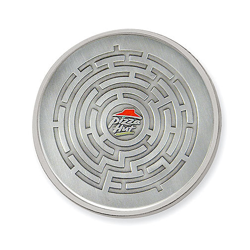 A circular solid pewter coaster with a maze motif and featuring the Pizza Hut logo at its center.