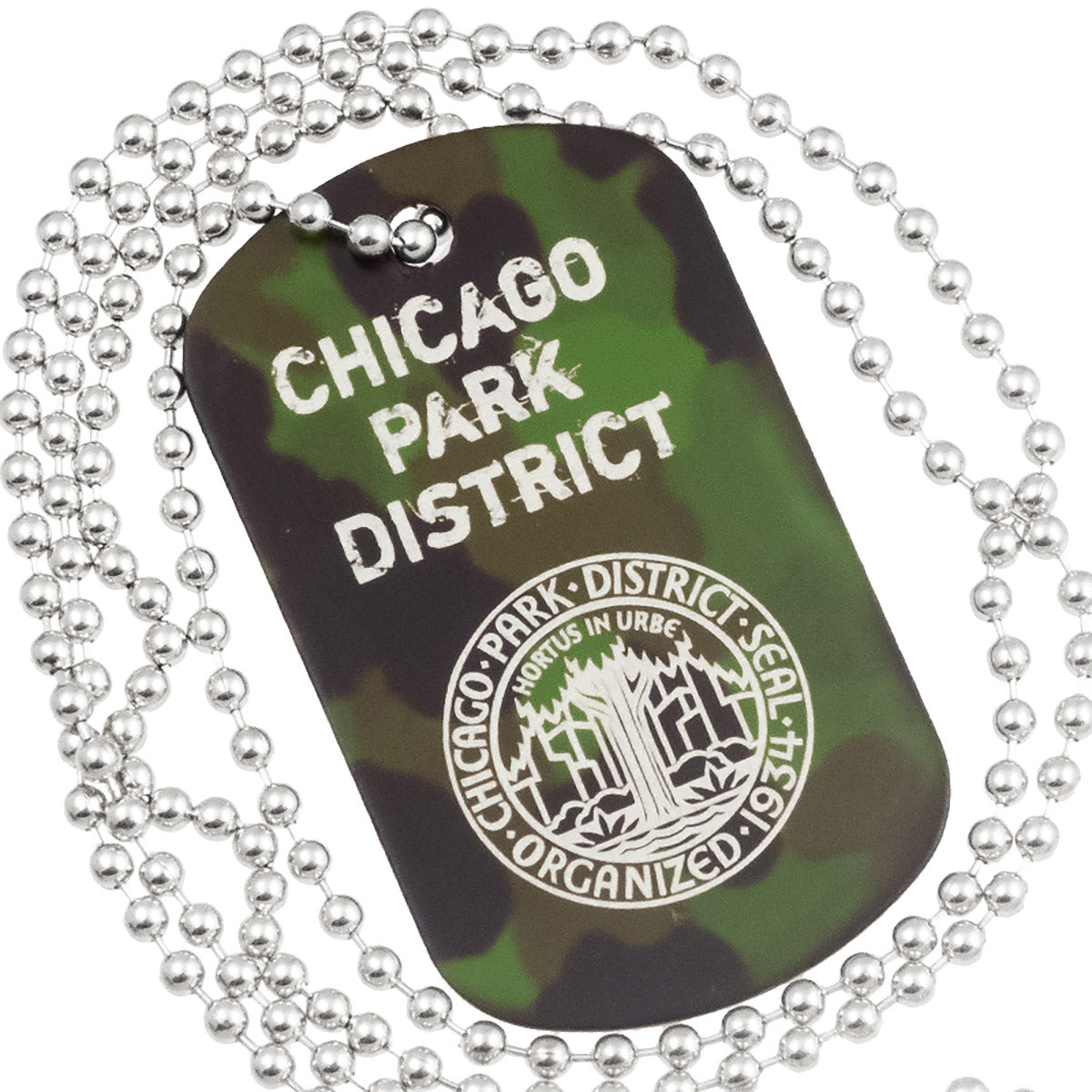 Close up example of camouflage anodized aluminum dog tag with engraving of text and logo. Image also shows the 30" ball chain.