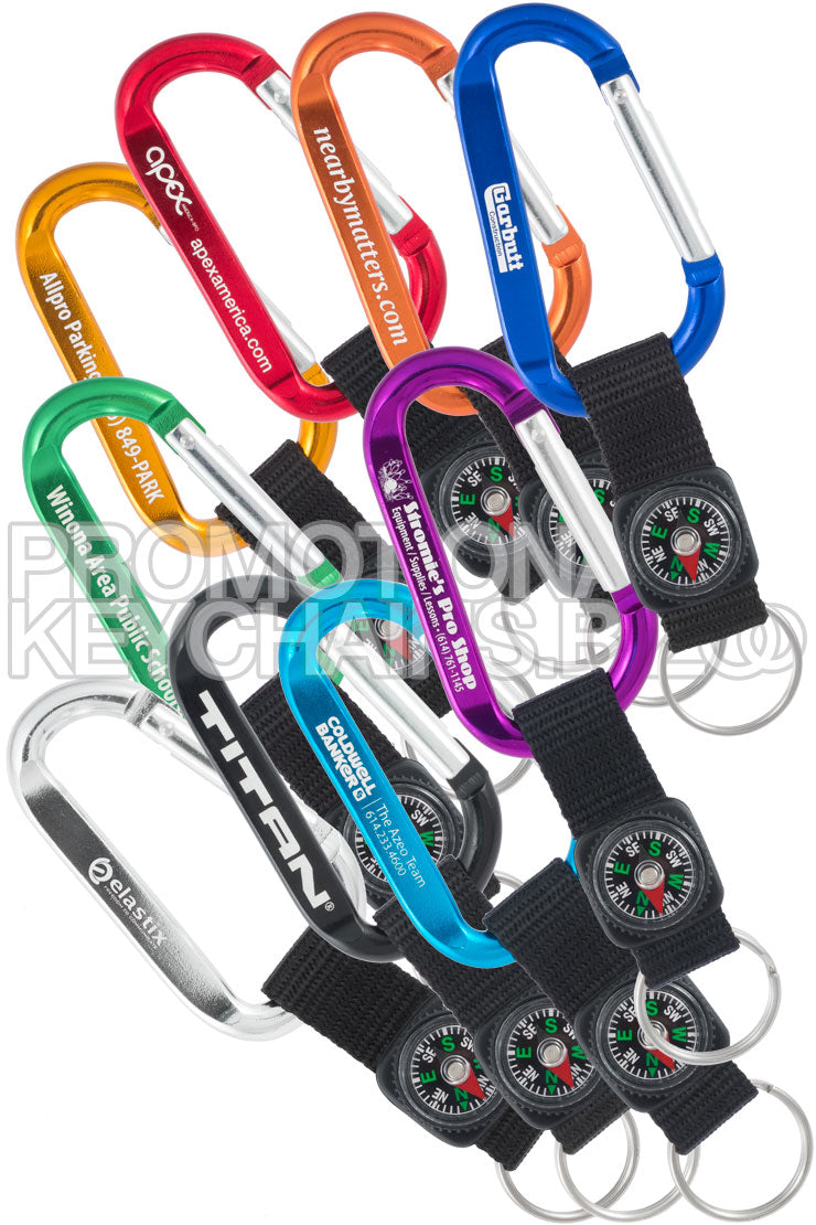A colorful selection of promotional carabiners in various colors, each featuring a compass strap and customizable with a promotional message.