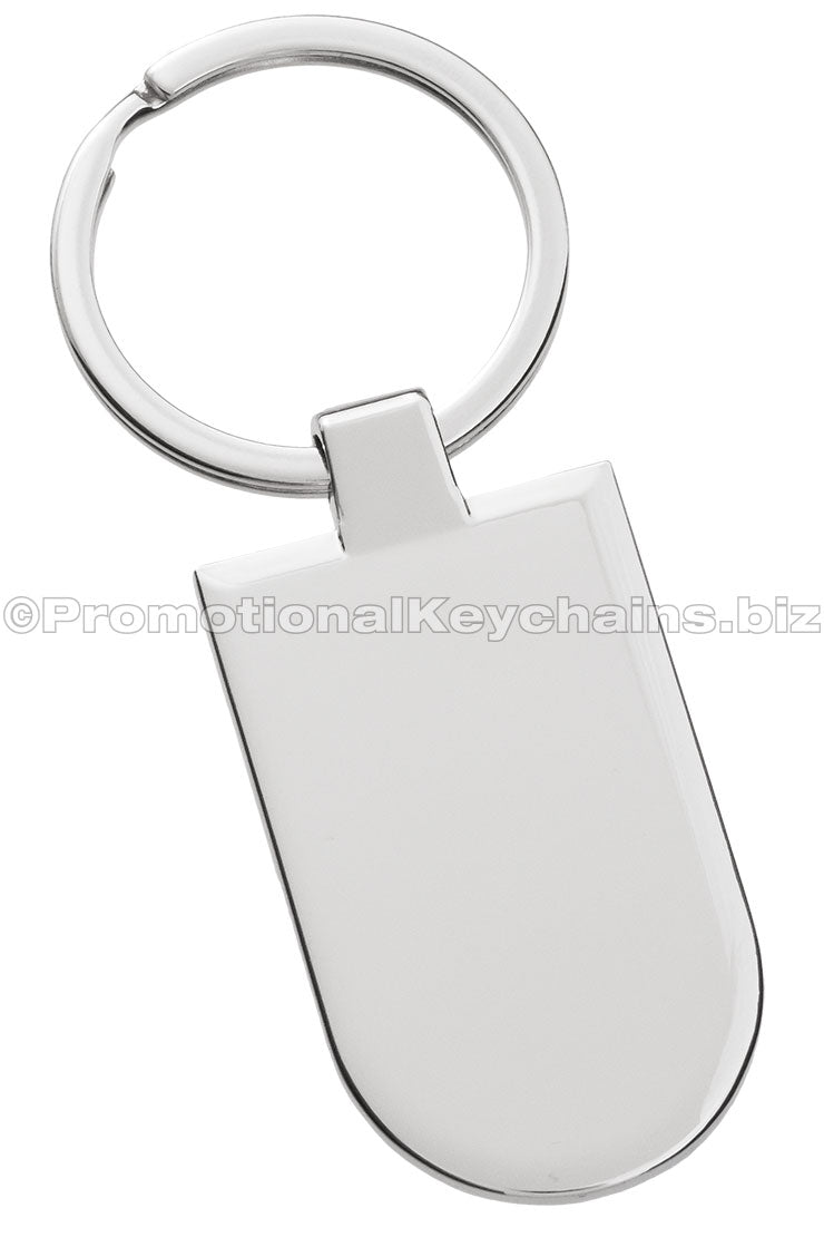 The back of a polished metal badge keychain.