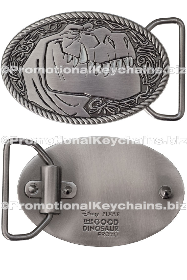 Two views of an antiqued metal belt buckle featuring a dinosaur design, branded with Disney/Pixar.