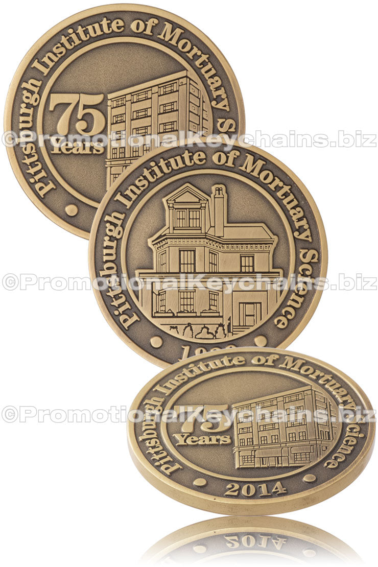 Three different angles of an antiqued gold coin commemorating the Pittsburgh Institute of Mortuary Science's 75 years anniversary, featuring architectural imagery on both sides.