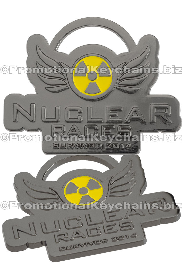 Two gray 'Nuclear Races' keychains with yellow radiation symbols on a white background.