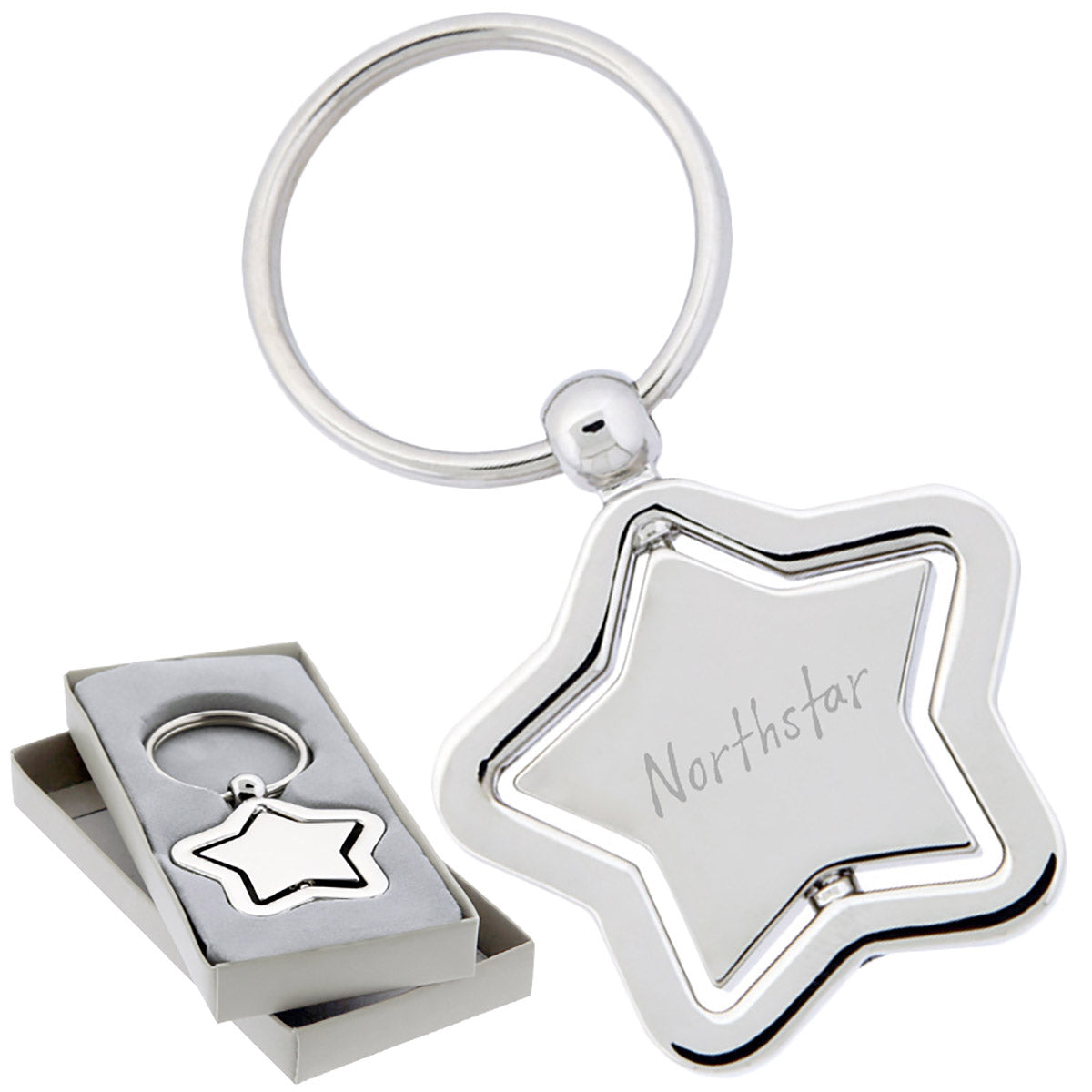 There are two images. On the left, a polished metal star-shaped keychain with a spinning center. It is displayed in a grey gift box. On the right is the same keychain with a logo clearly engraved in the center.