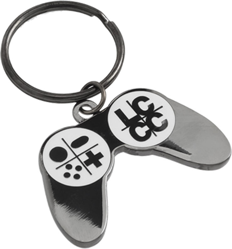 A polished black nickel game controller-shaped keychain featuring the LCCC logo in white enamel color.