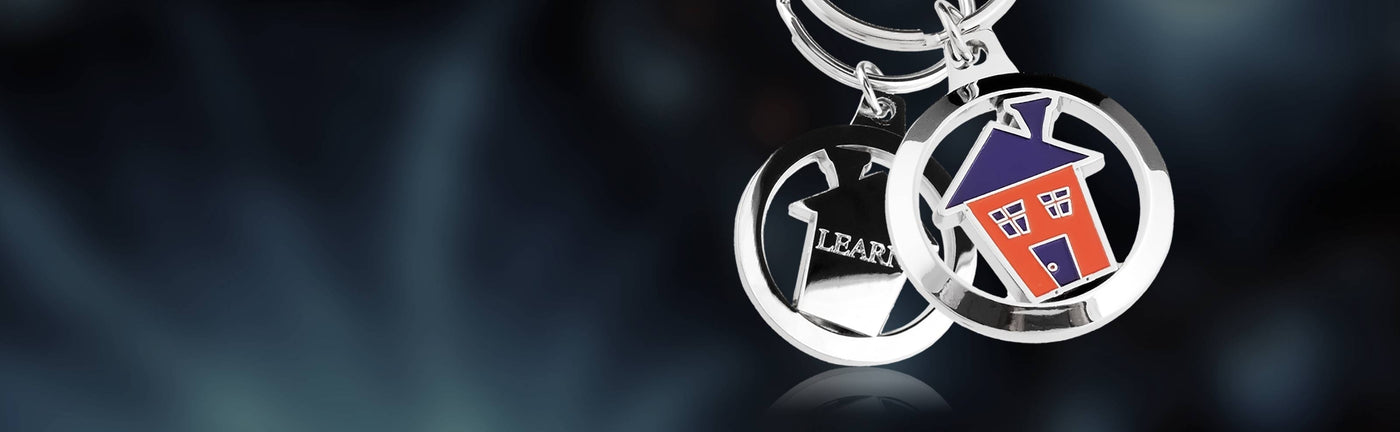 Keychain with house design on a blue background