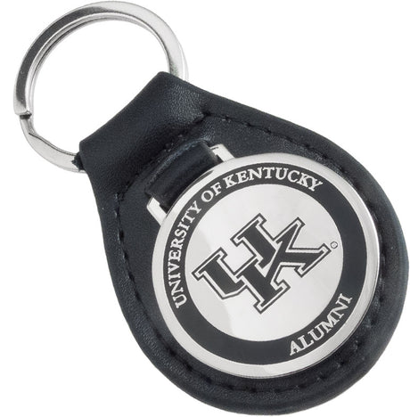 A black leather fob keychain with a polished nickel medallion attached, featuring a University of Kentucky Alumni design with a black enamel outer ring.