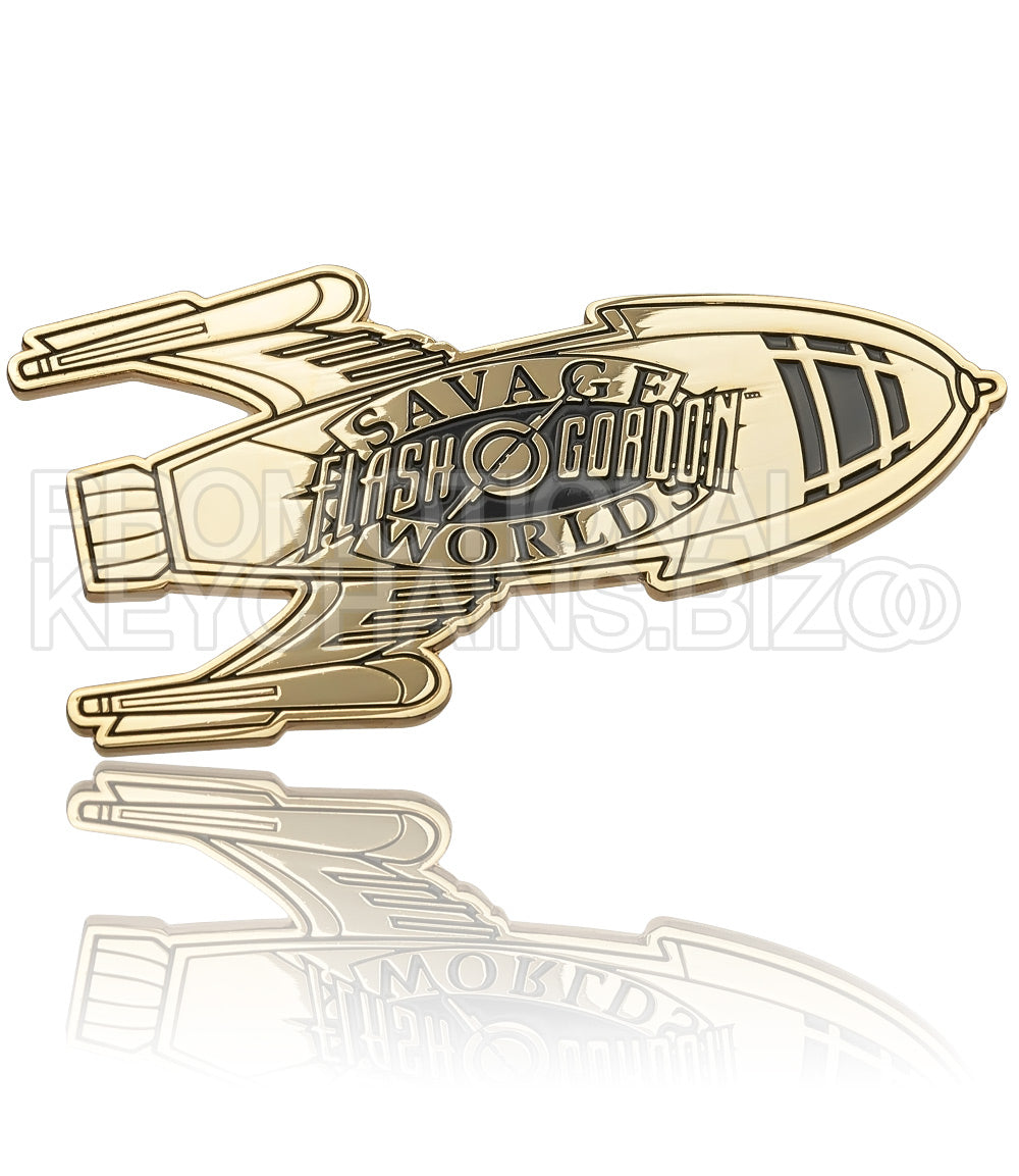 A polished brass plate featuring a retro spaceship design with "Flash Gordon" branding at its center in black enamel color.