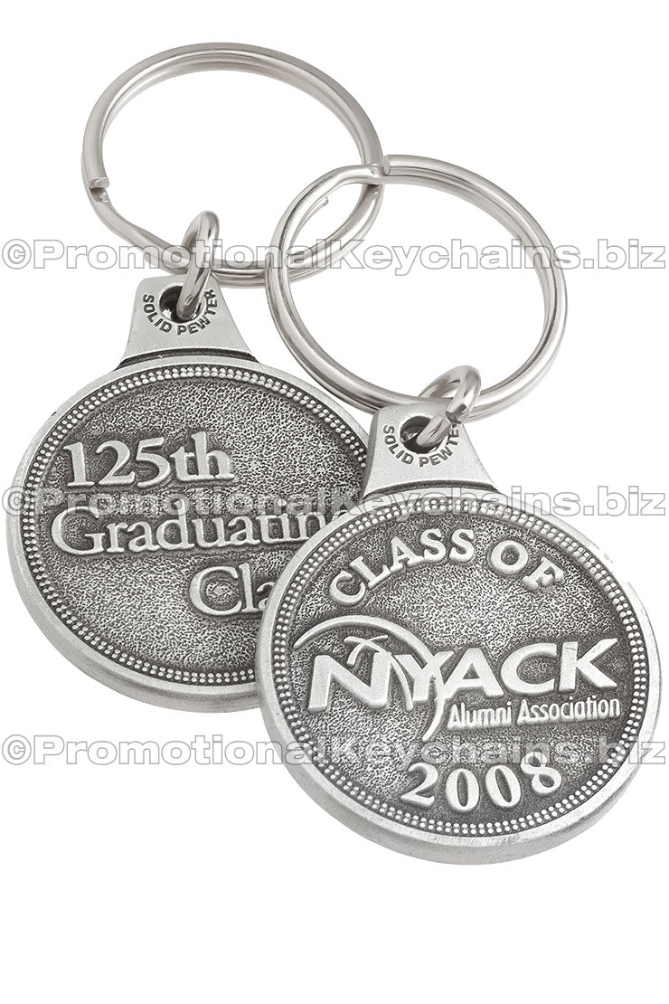 Front and back of the same genuine pewter keychain, circular in shape. It features the logo for "NYACK" embossed on the front and "125th Graduating Class" embossed on the back.