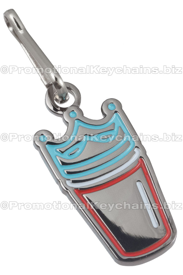 A polished nickel zipper pull shaped like a drink cup with a blue crown, featuring red and white enamel color accents.