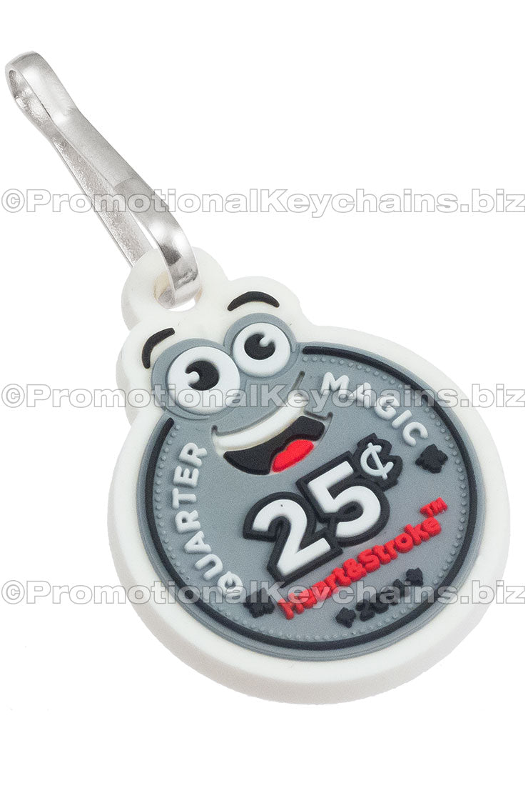 A PVC zipper pull featuring a smiling cartoon coin in white, black, grey, and red.