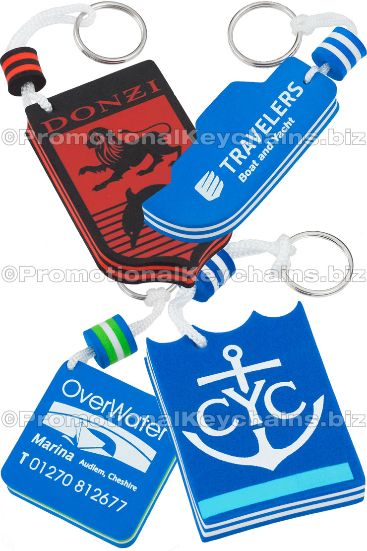 Four colorful foam floating keychains featuring logos for Donzi, Travelers Boat & Yacht, CYC, and OverWater Marina.
