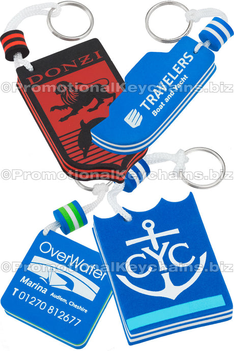Four colorful foam floating keychains featuring logos for Donzi, Travelers Boat & Yacht, CYC, and OverWater Marina.