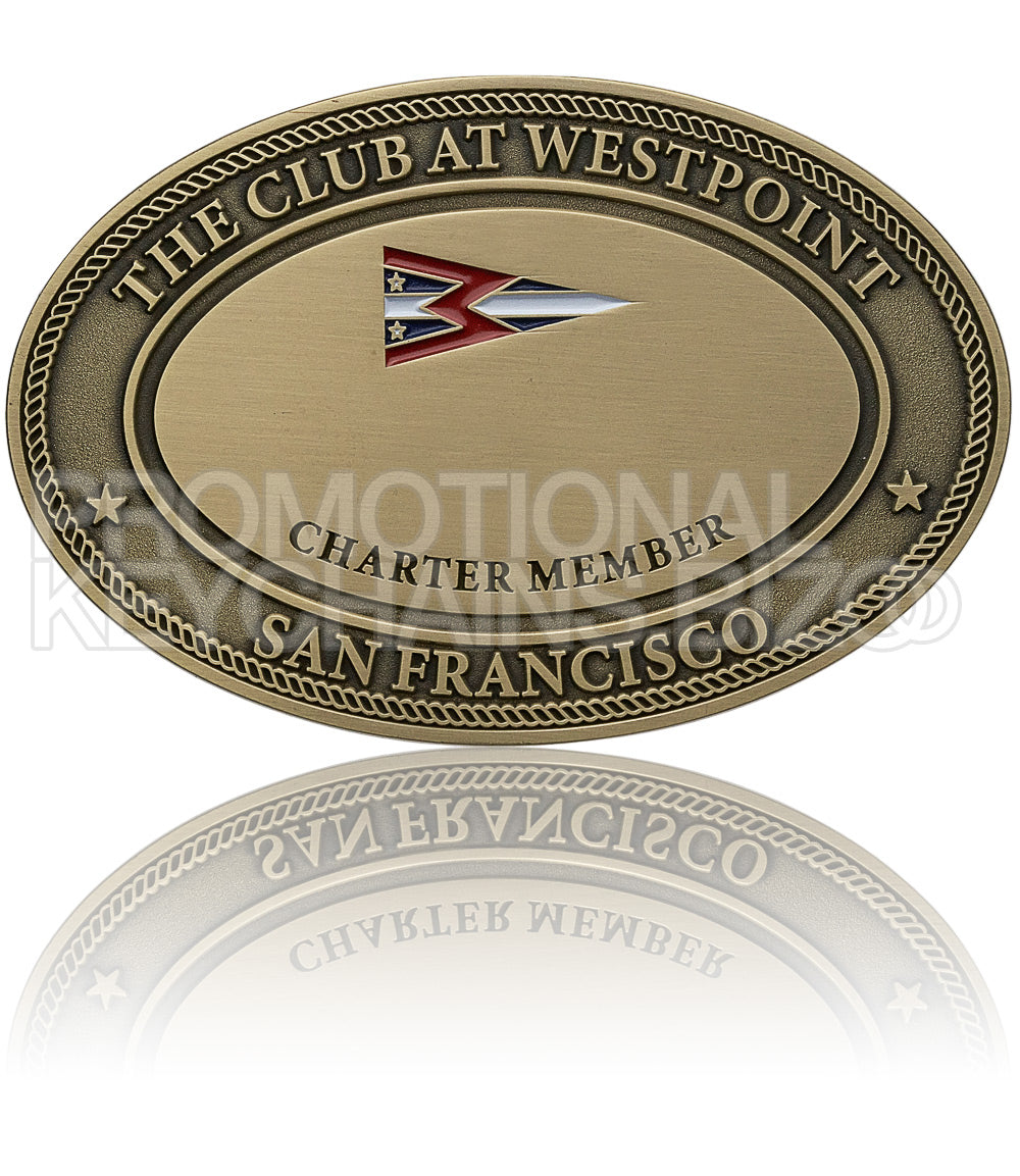 An antiqued bronze oval plate for "The Club at Westpoint," featuring a multicolored flag emblem.