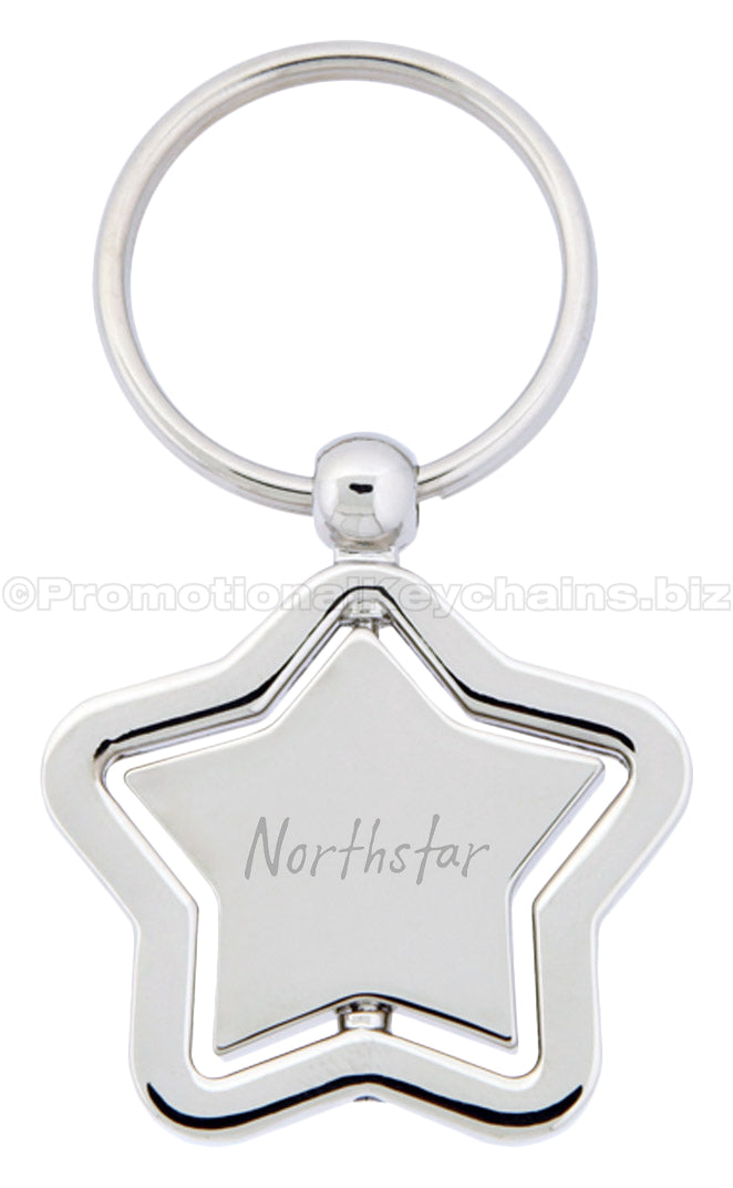 A polished metal star-shaped keychain with a spinning center that is engraved with "Northstar".