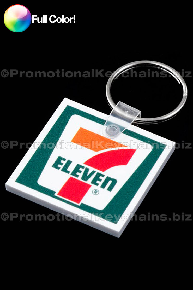 A full-color square vinyl keychain with a promotional print of the 7-Eleven logo.