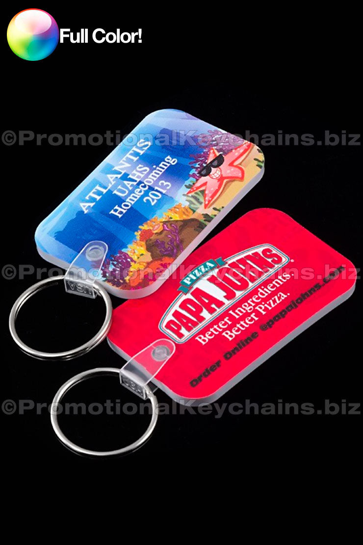 A set of full-colored vinyl keychains with various designs, including a Papa Johns pizza keychain and Atlantis UAHS.