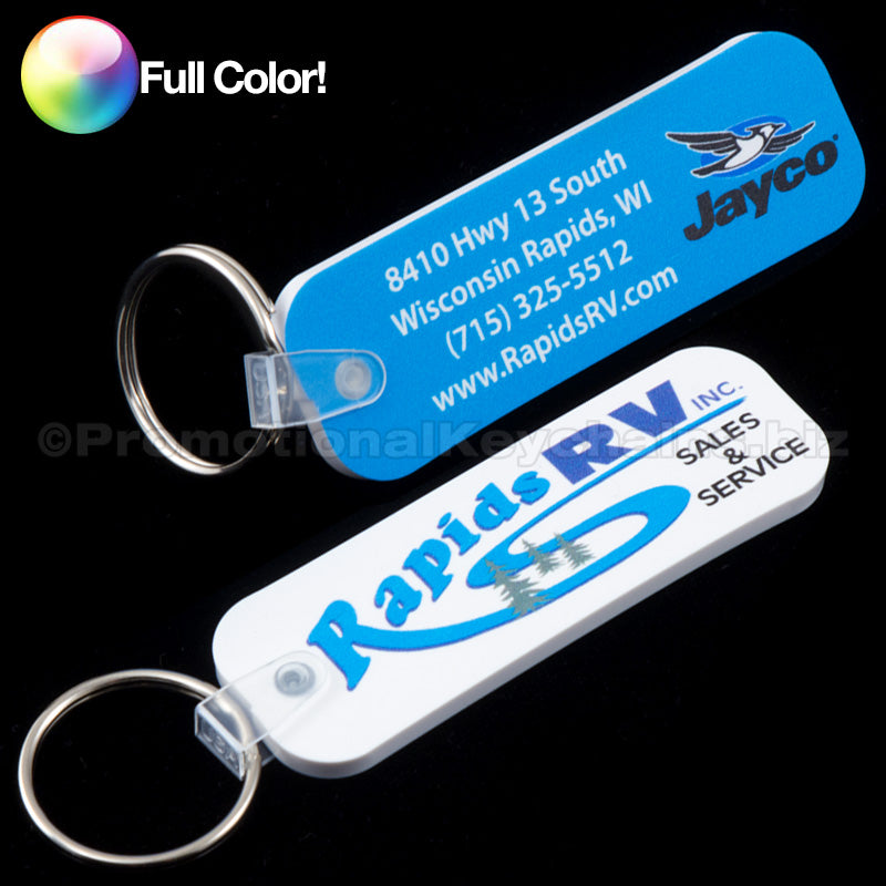 Two long rectangle vinyl keychains with full color imprinting. One keychain is blue with white text and is the front, and the other is the back and has white with blue text, with a promotional message and the company website URL.