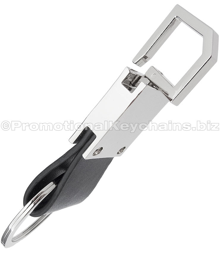 The side view of a polished metal keychain with a leather strap and a pull and twist feature on the other end.