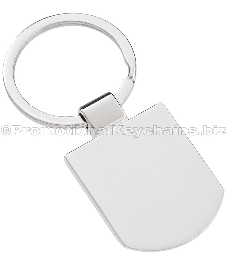 The back of a polished silver keychain featuring a badge-shaped pendant.