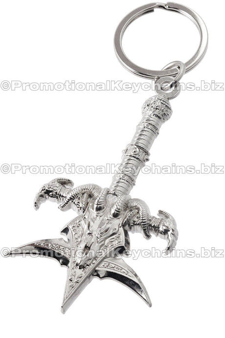 A polished nickel keychain featuring a detailed, ornate mace design with dragon themed motifs.