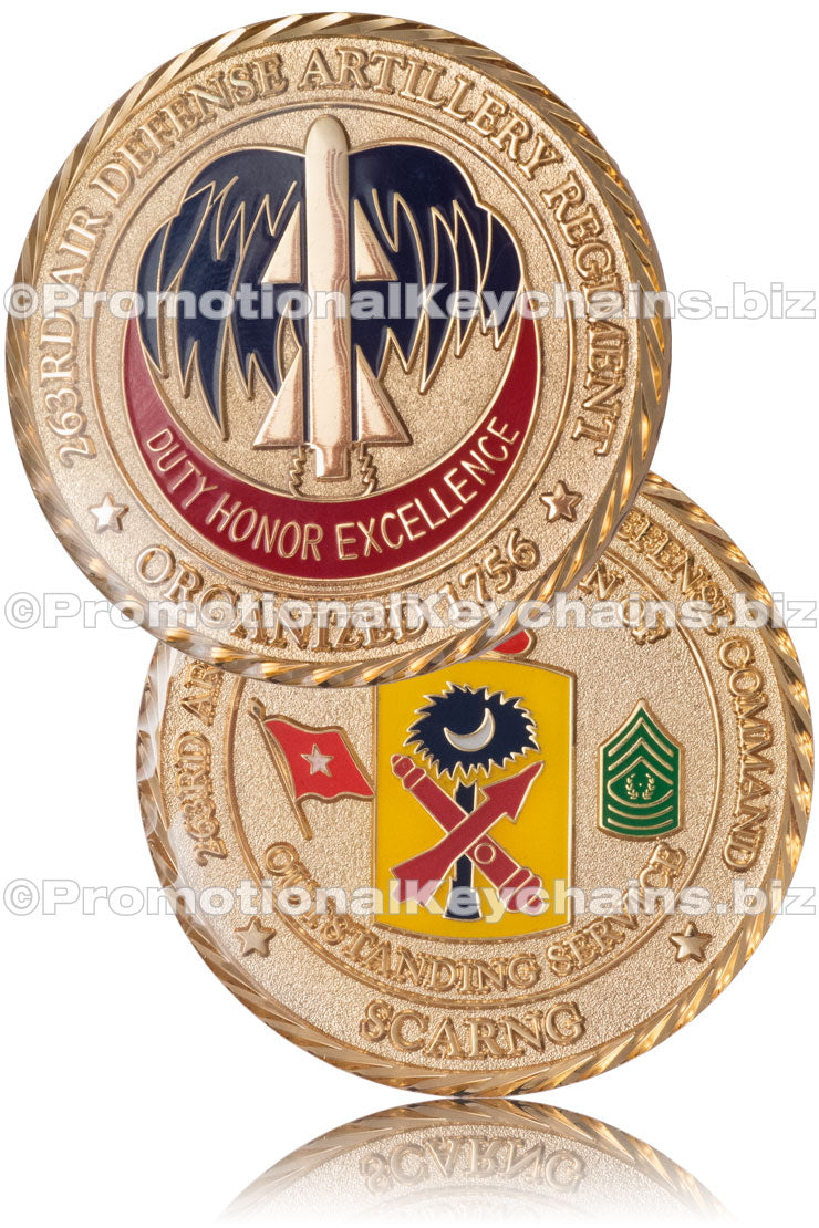 The front and back of a polished, gold-plated military coin, celebrating excellent service in the 263rd Air Defense Artillery Regiment. There are various military emblems and flags in an assortment of enamel colors.