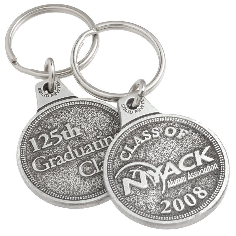 Front and back of the same genuine pewter keychain, circular in shape. It features the logo for "NYACK" embossed on the front and "125th Graduating Class" embossed on the back.