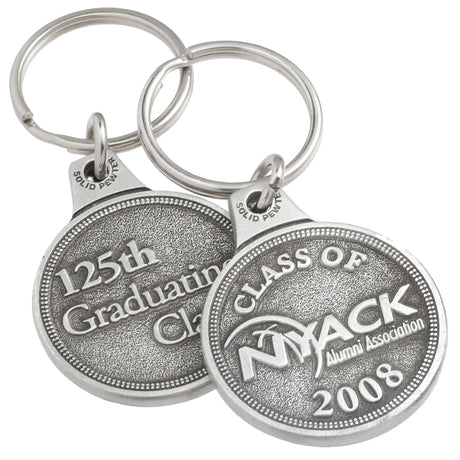 Front and back of the same genuine pewter keychain, circular in shape. It features the logo for "NYACK" embossed on the front and "125th Graduating Class" embossed on the back.