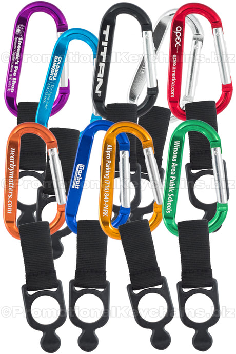 A collection of carabiner keychains in various colors including black, blue, green, orange, purple, red, and silver, all with customized engraving.