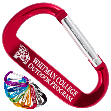 Custom engraved XTREME carabiner keychains. A large red carabiner takes up most of the space with a smaller fan of a rainbow of colors of carabiner in the lower left corner on a white background