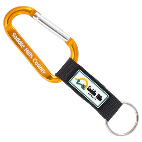 Gold colored carabiner with a custom PVC label strap