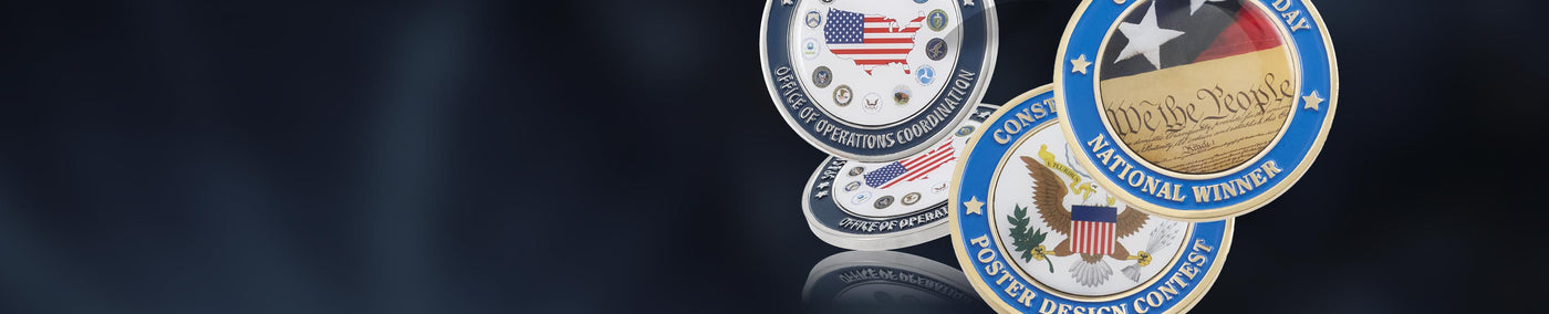 Collection of coins with various full color designs against a contrasting dark background.