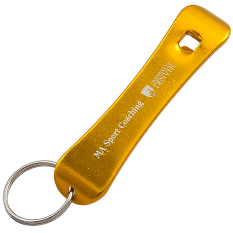 Gold colored bottle opener keychain shaped like a snowboard with a customized engraving on the bottom