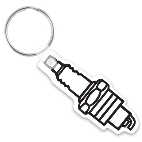 White keychain shaped like a spark plug with a black imprint depicting the spark plug