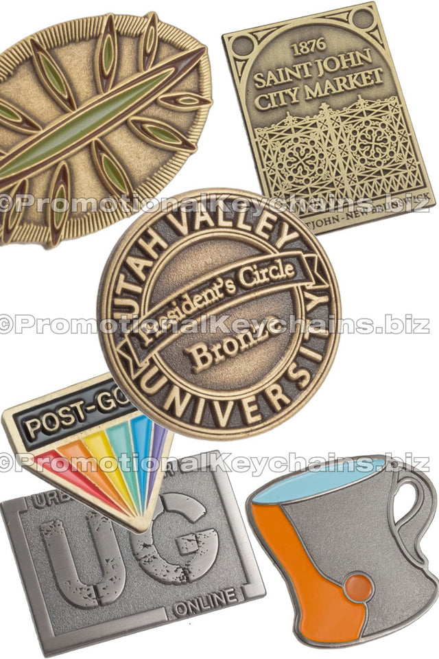 Group of antiqued lapel pins showing different antiqued colors like brass, gold and nickel. Also shows different shapes like circle, rectangles and some custom shapes. 