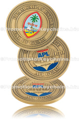 Three angles of an antiqued brass coin, featuring a multicolor Guam seal on the front and an APL ship design on the back, commemorating "Guam Saipan Express".