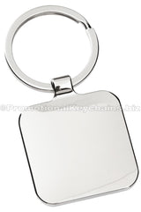 The blank back of a polished metal keychain, square in shape.