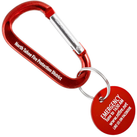 Red carabiner with medallion with Emergency laser engraved.
