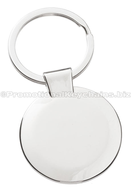 The blank back of a circular polished metal keychain.