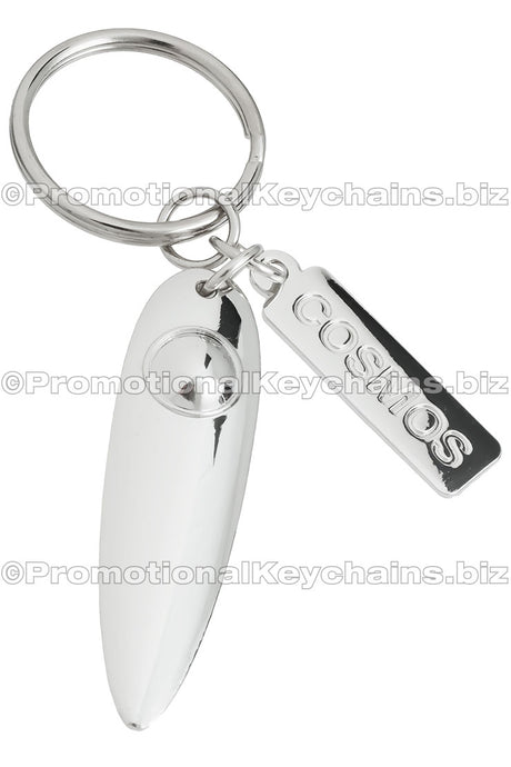 A sleek polished nickel keychain with an elongated design and attached rectangular tag labeled "COSMOS." 