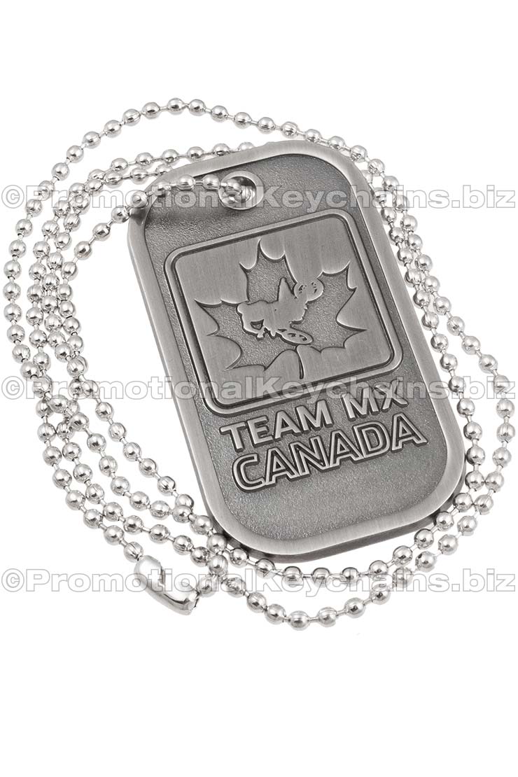 Brushed Antiqued Custom Die Cast Dog Tag. Antiqued nickel plating with a design of a Canadian leaf and a biker in center. 