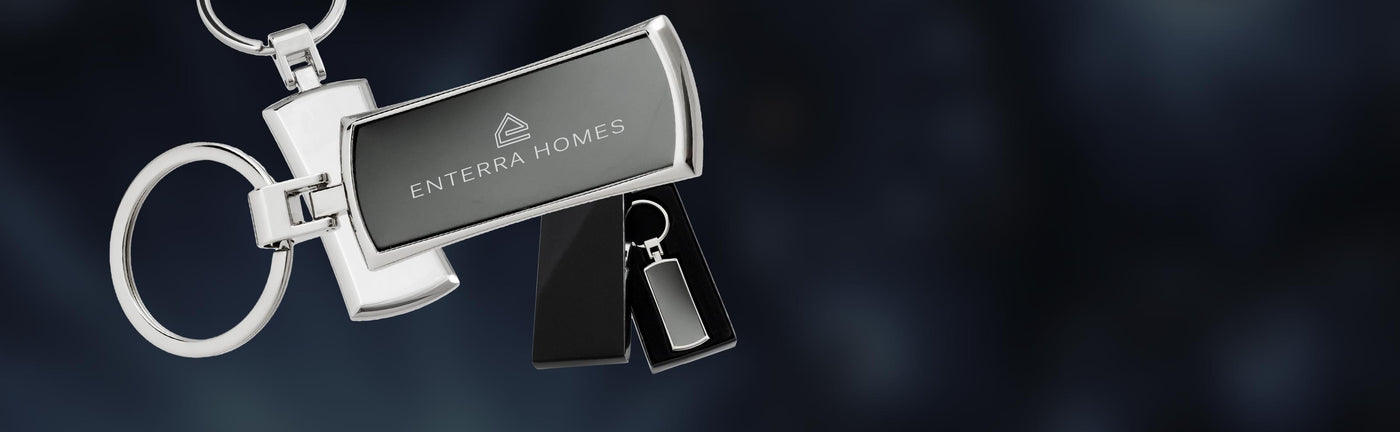 Custom branded keychain showing front and back, and packaging, on a contrasting dark background.