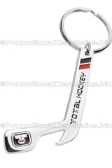 Custom shaped bottle opener keychain in the shape of a hockey stick. Hook at the end of the hockey stick and design uses black and red enamels. 