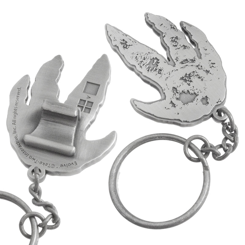 Close up of custom shaped claw style bottle opener. Bottle opener is shaped like a dinosaur foot print. On the back is the claw style hook. 